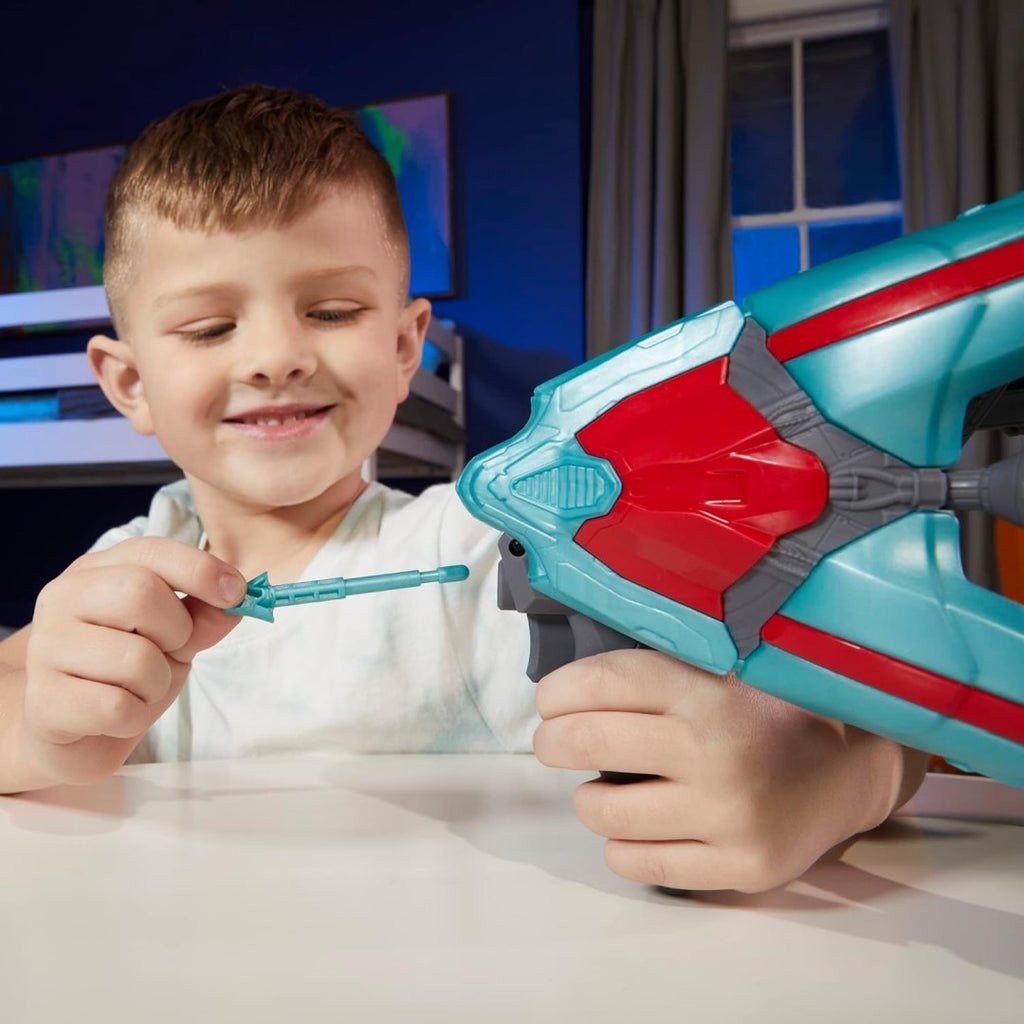 Close-up of a child loading a projectile into the Galactic 2-in-1 Spaceship launcher.