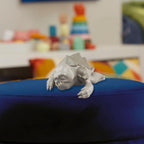 Close-up manufacturer view of the sleeping Rancor figure included in the Grogu and Rancor Taming the Beast Pack
