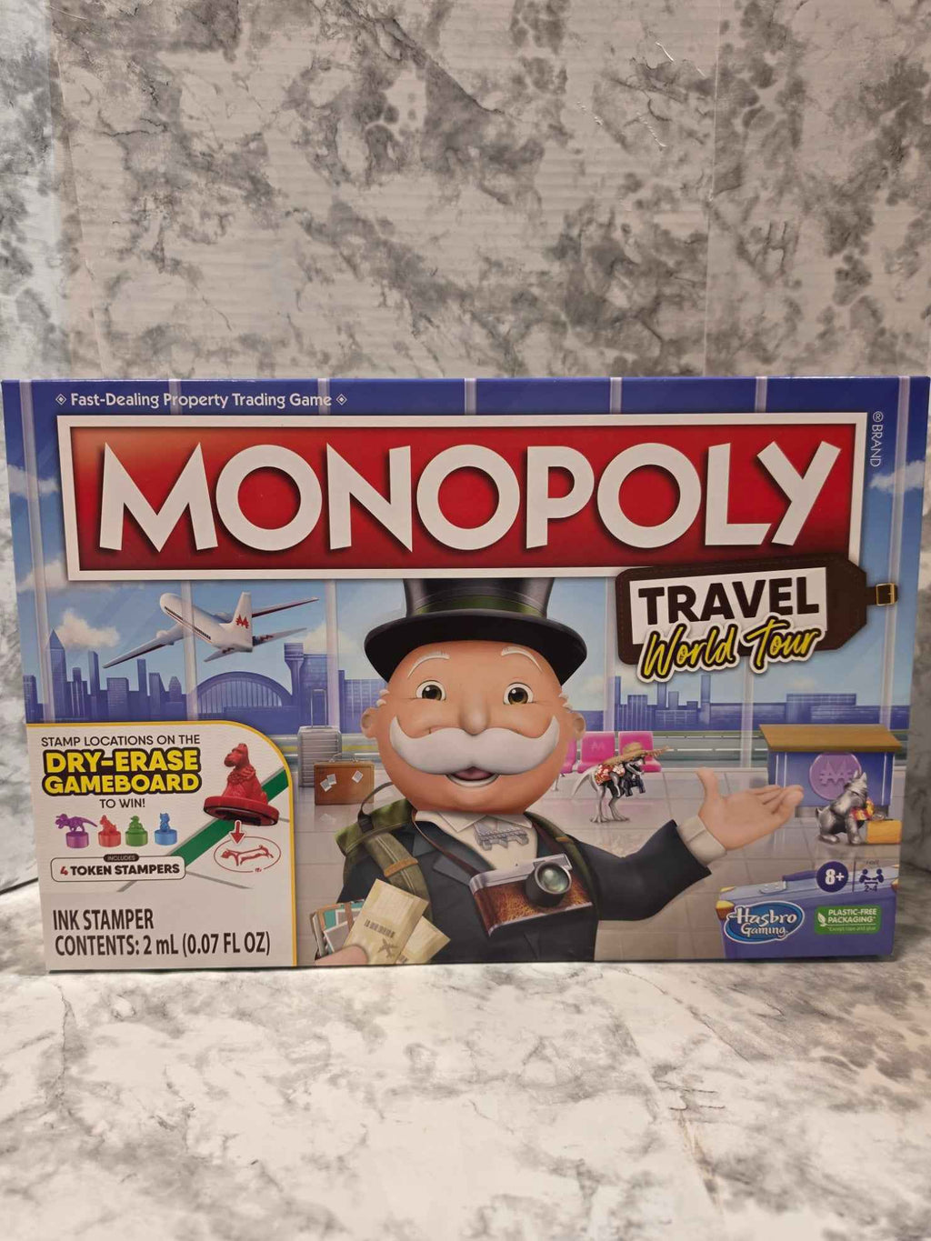 Actual stocked Hasbro Monopoly Travel World Tour board game box, F4007, ages 8+, front package