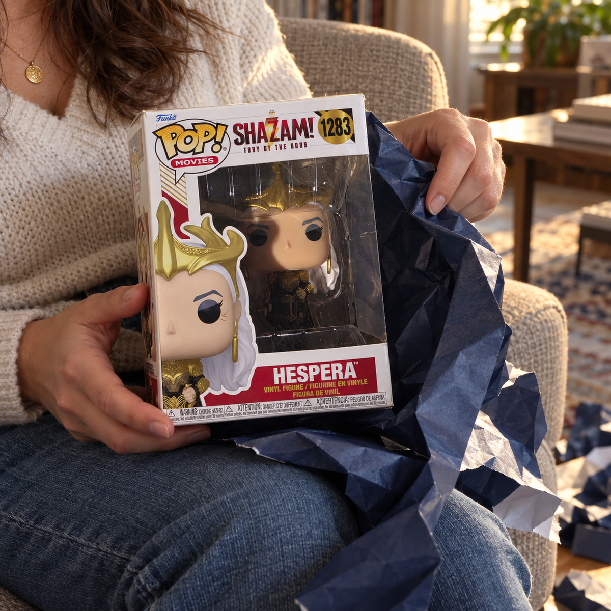 Boxed Funko Pop! Hespera #1283 being unwrapped from gift paper.