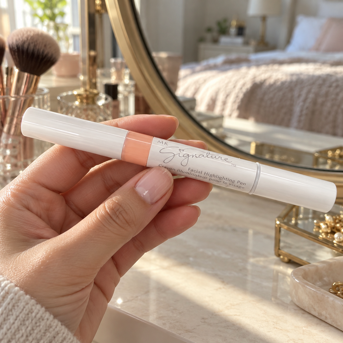 Capped MK Signature Shade 1 highlighting pen held beside a dressing-table mirror.