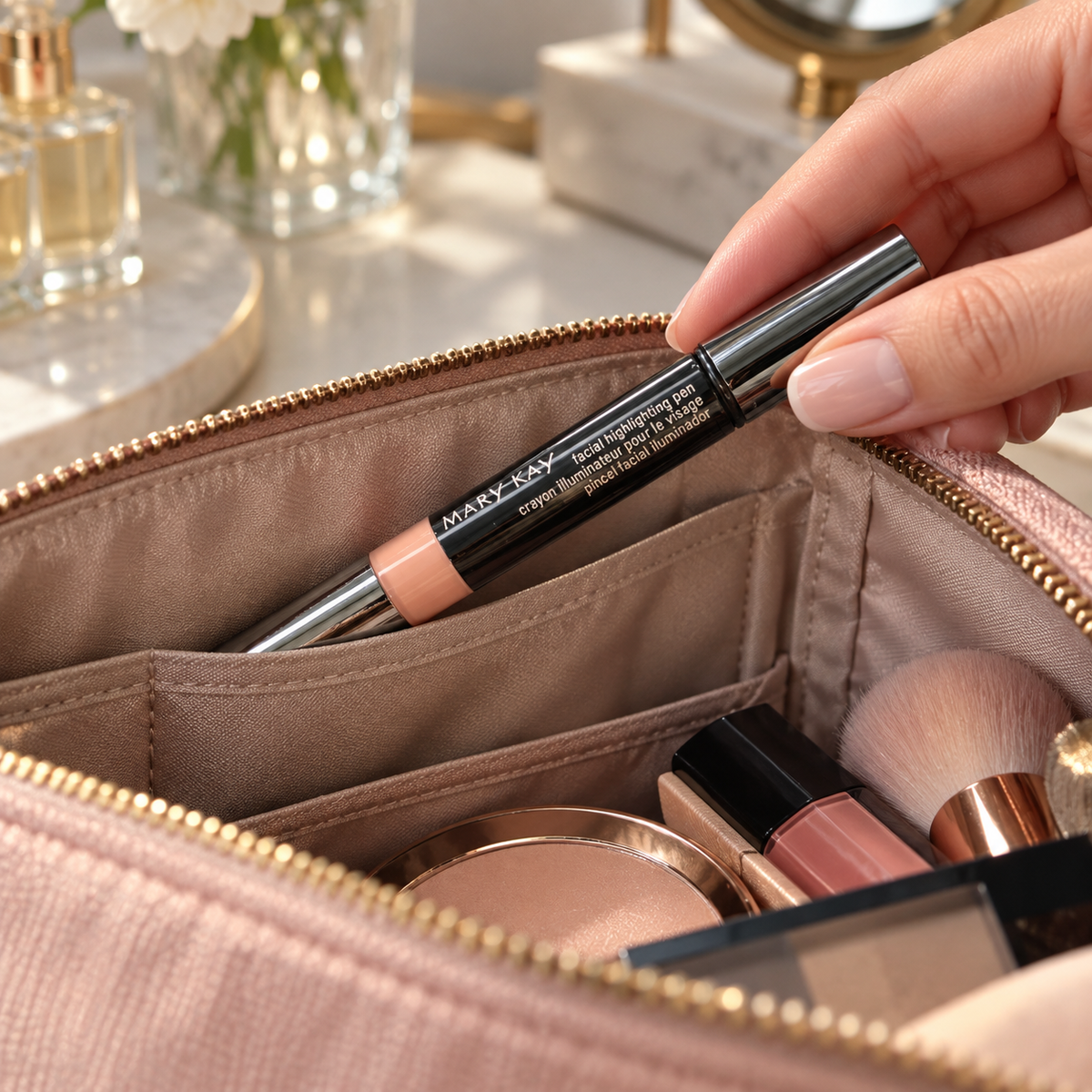 Standard Mary Kay Shade 1 highlighting pen being packed into a cosmetic bag with its cap on.