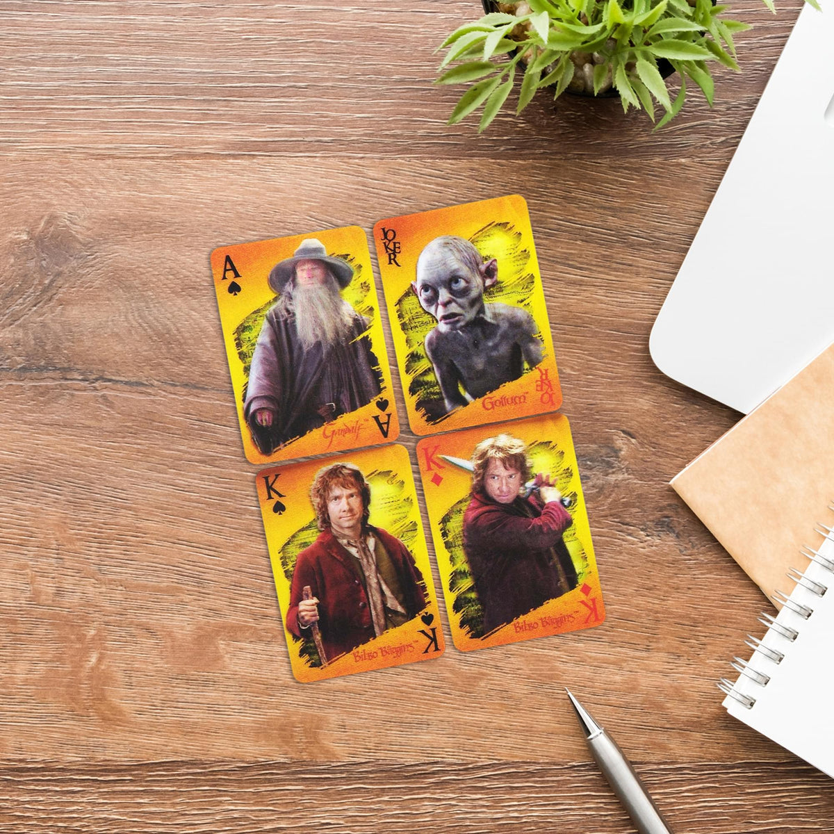 Gandalf, Gollum and Bilbo character cards arranged on a tabletop.