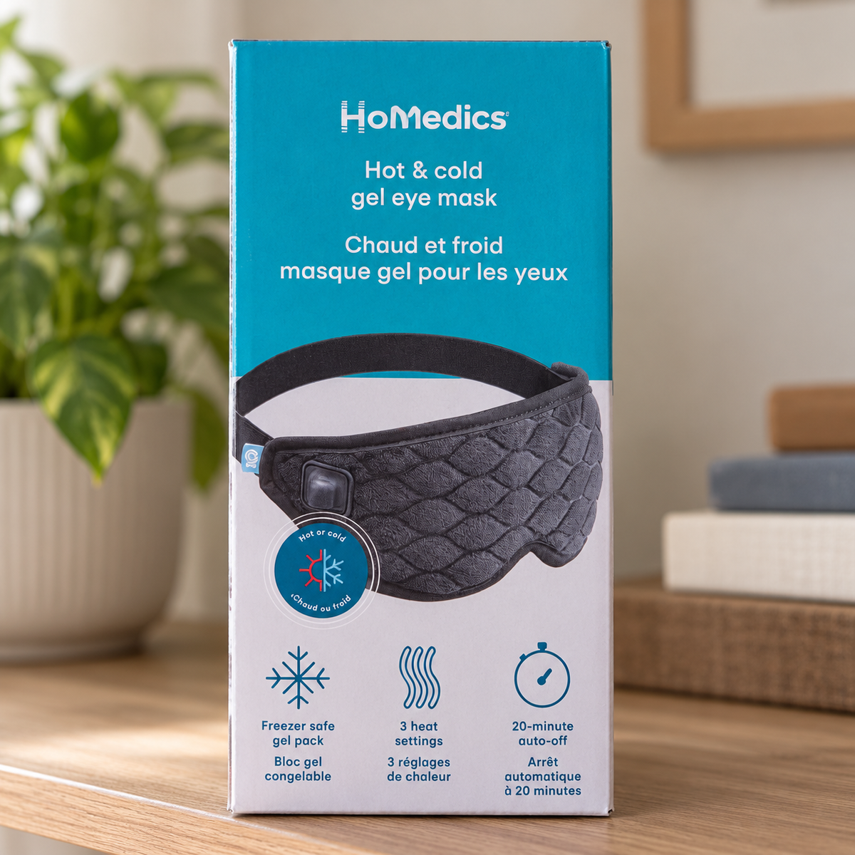 AI lifestyle illustration of HoMedics HP-G42A-CA boxed eye mask in home shelf setting; props not included