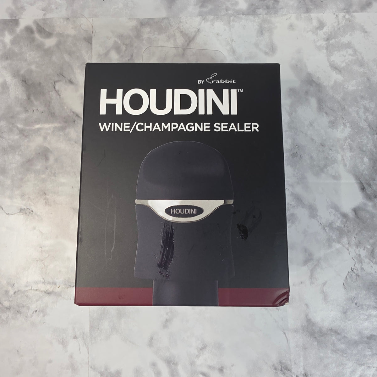 Actual More4less inventory photo of the black Houdini by Rabbit wine and champagne sealer in its retail box.
