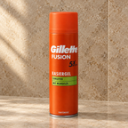 Gillette Fusion Sensitive shave gel can against a warm stone backdrop