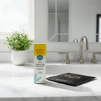Burt's Bees Skin Balancing Gel Cream box alongside designer face mask and fresh houseplant on contemporary brightly-lit morning vanity