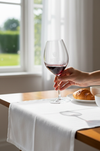 Hand swirling Riedel 002 crystal red wine glass ruby wine sunlit morning dining space — More4less Outlet
