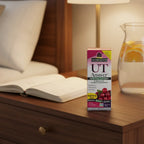 Nature's Answer UT Answer D-Mannose Cranberry box on dark-oak bedside table with open wellness journal and glass water pitcher with citrus