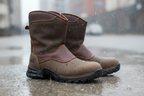 Timberland PRO Excave pull-on work boots standing on wet concrete in rain — waterproof membrane keeps feet dry in tough conditions