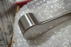 Macro detail of PVD brushed nickel finishing on contemporary single-handle faucet lever