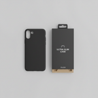 Flat-lay top-down view of black OtterBox Symmetry case beside retail box on neutral gray surface