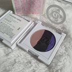 Mary Kay At Play Baked Eye Trio close-up showing baked eyeshadow shimmer in purple, blue-black, and champagne taupe
