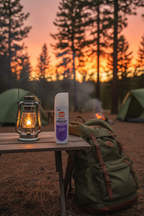 OFF! Clean Feel Insect Repellent on camping table beside lantern and backpack at golden hour dusk