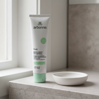 Arbonne Instant Cooling Moisture Mask with Peppermint 5 oz tube on a neutral bathroom shelf