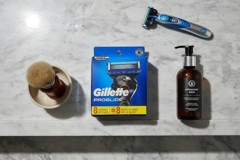 Gillette ProGlide 8 Count Razor Blade Refills grooming flat lay marble shelf shaving brush aftershave razor handle