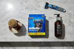 Gillette ProGlide 8 Count Razor Blade Refills grooming flat lay marble shelf shaving brush aftershave razor handle