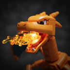 MEGA Pokémon Charizard building set close-up of assembled head with open mouth and translucent fire breath elements with dramatic fire glow lighting