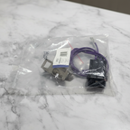 Choice WB2X8228CM Bakelite range burner receptacle block kit in clear polybag on clean marble surface appliance repair part lifestyle photography