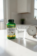 Nature's Bounty Ashwagandha KSM-66 90 Tablets on white quartz kitchen island with glass of water and modern clock — More4less Outlet.