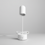 White 16-inch LED desk lamp with base AC outlet on a neutral desk