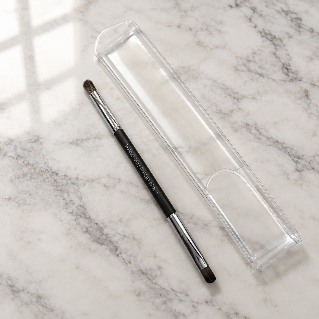 AI-generated lifestyle photo of the Mary Kay Dual-Ended Eye Definer and Eye Crease Brush on a vanity countertop with its travel sleeve