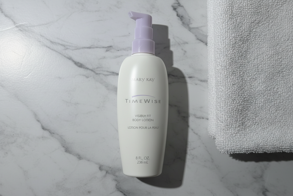 Mary Kay TimeWise Visibly Fit Body Lotion bottle in flat lay on white marble with soft white towel