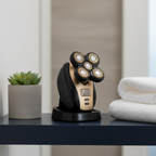 Freedom Grooming Charging Dock black and gold on dark navy bathroom vanity shelf next to plant and white towel – More4less Outlet