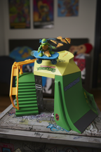 Leonardo Switch Kick Skater figure performing trick on TMNT Mini Madness Skate Park half pipe ramp
