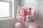 Organized modern shower caddy featuring quality women's personal care products with pink accents