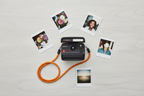 Polaroid Flip instant camera black flat lay with colorful instant prints and orange wrist strap — More4less Outlet