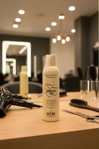 Itely Hairfashion Thermoactive Fluid on stylist workstation in upscale hair salon with warm boutique lighting — More4less Outlet