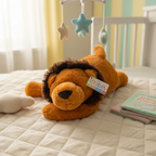 Ebba Baby Lion Plush lying flat on soft nursery blanket surrounded by gentle pastel nursery decor - More4less Outlet