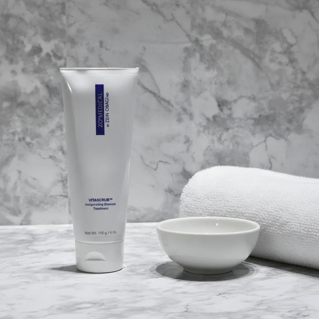 ZO Medical Vitascrub on gray granite bathroom counter with white towel and porcelain bowl