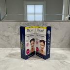 Bioré Original Deep Cleansing Nose Pore Strips two-box bundle on a marble counter beside a plain bathroom mirror