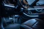 12V LED power hub mounted under car dashboard with blue and white LED flex strip lights glowing in vehicle interior