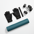 Gaiam black fitness gloves with padded palms laid flat on white gym surface next to dumbbells and yoga mat – More4less Outlet