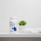 GNC Folic Acid bottle on wellness shelf with succulent and white linen towel – More4less Outlet
