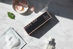 Mary Kay Reviving Facial Spray black and pink box in minimalist morning skincare flat lay on white marble