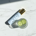 JAFRA Royal Revitalize Extra Hydration Serum on marble surface with cucumber water – More4less Outlet