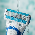Water droplets cascading over a sharp multi-blade razor cartridge