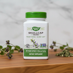 Nature's Way Skullcap Herb 850 mg bottle on a natural wood surface with botanical styling