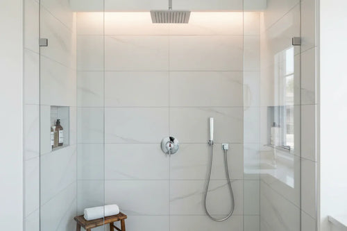 Minimalist professional bathroom shower wall volume control assembly in polished chrome