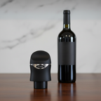 AI-generated lifestyle image of one black Houdini by Rabbit wine and champagne sealer beside one wine bottle in a home wine-bar setting.