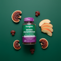 Fungies Reishi Mushroom Gummies bottle on dark green surface with apple slices and dried reishi mushrooms – More4less Outlet