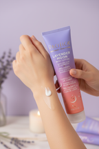 Woman with smooth glowing skin applying Pacifica Lavender Moon Body Lotion soft lavender background