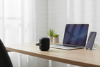 JVC Gumy SP-SG1BT wireless Bluetooth speaker black on home office desk with laptop and phone – More4less Outlet