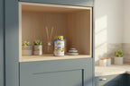 Zarbee's Children's Calm gummies bottle on kitchen wellness cabinet shelf child-friendly environment