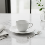 Bernardaud Organza fine Limoges porcelain tea saucer on marble surface with teacup, luxury French tableware