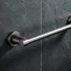 Close-up of wall-mounted matte steel bathroom accessory on dark slate tile showing smooth scratch-resistant finish